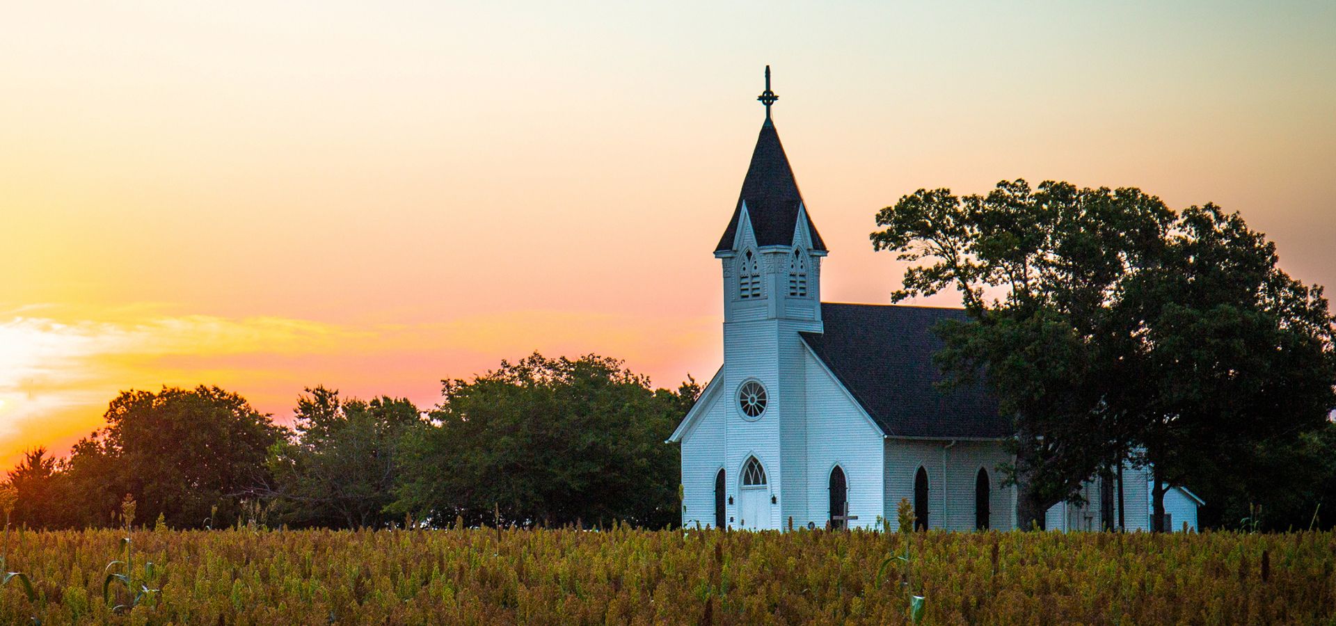 Church with steeple at sunrise