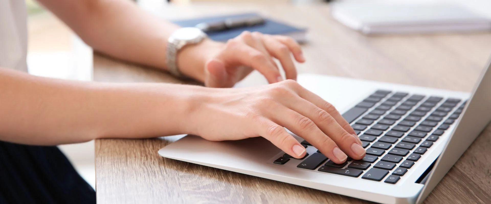 Person typing on a laptop